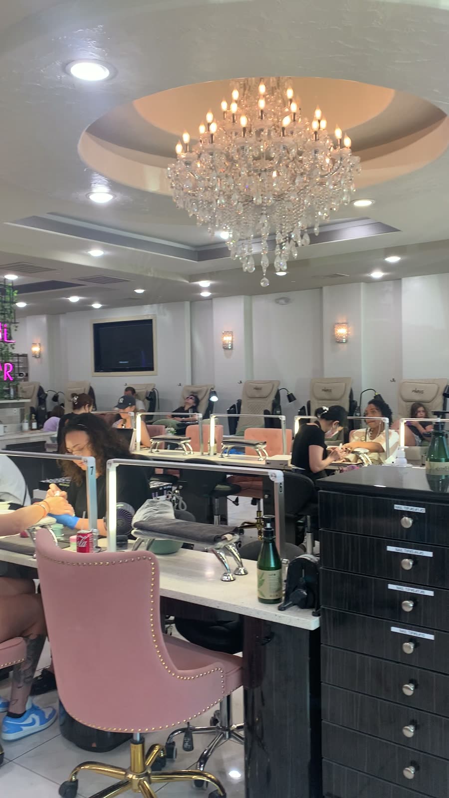 Crystal chandelier above the manicure bar